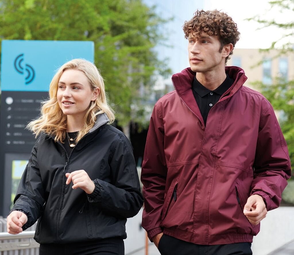 Two people wearing jackets outdoors